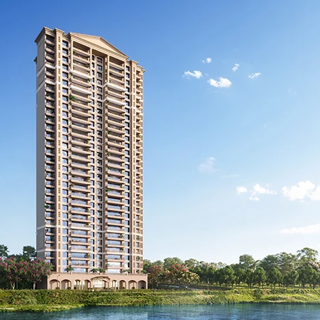 Lodha Azur, Bannerghatta Road Residential tower beside a lake under a blue sky, Lodha Azur